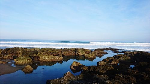 Scenic view of sea against blue sky