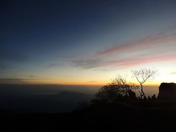 Scenic view of silhouette landscape against sky at sunset