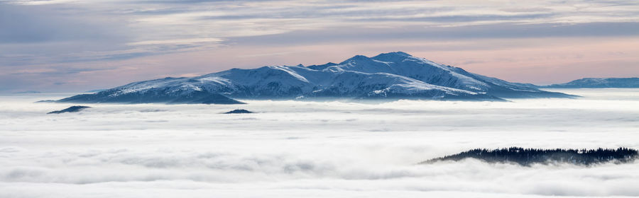 Scenic view of snow covered mountains