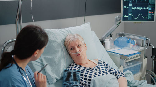 Doctor examining patient in hospital