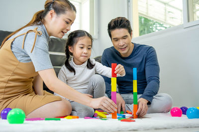 Siblings sitting on table