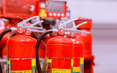 Close-up of red fire extinguishers
