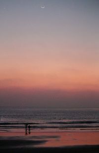 Scenic view of sea at sunset