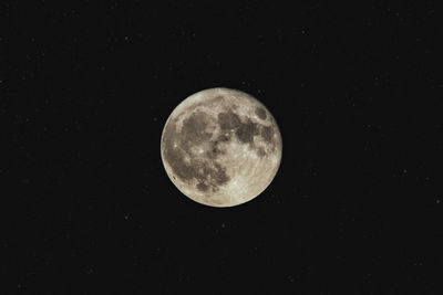 Low angle view of full moon in sky