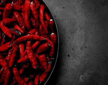 Close-up of red chilies on table