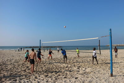 Scenic view of beach against blue sky