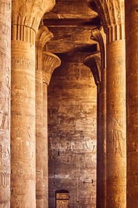 Interior of ancient temple in egypt. pillars with egyptian hieroglyphs. popular egyptian landmark