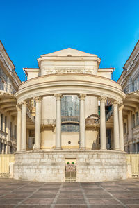 Facade of historic building against blue sky