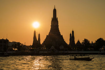 Low angle view of city at sunset