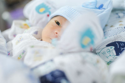 Cute baby sleeping on bed