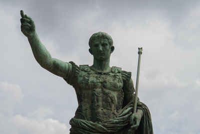 Low angle view of statue against sky