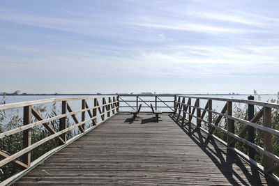 Pier over sea against sky