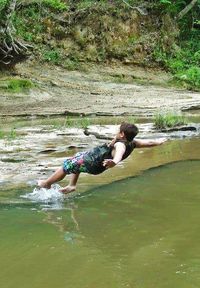 Full length of woman enjoying water