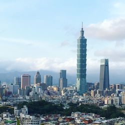 Modern buildings in city against sky