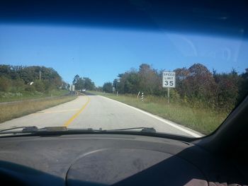 Road passing through forest