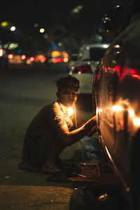 Man playing lit up at night