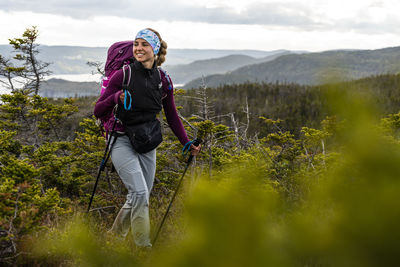 Female hiker trekking along east coast trail in newfoundland