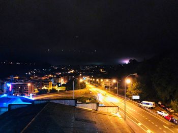 High angle view of light trails on city street at night