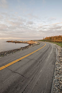 A road hugs the rugged coastline in acadia national park, maine