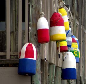 Close-up of multi colored decorations hanging on metal