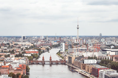 High angle view of city against cloudy sky