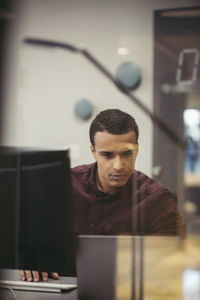 Portrait of man working in office