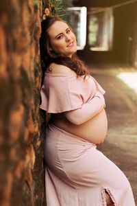 Portrait of smiling woman standing outdoors