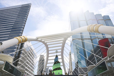 Low angle view of bridge and modern office buildings