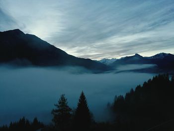 Scenic view of mountains in foggy weather 