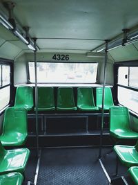 Empty green seats in bus