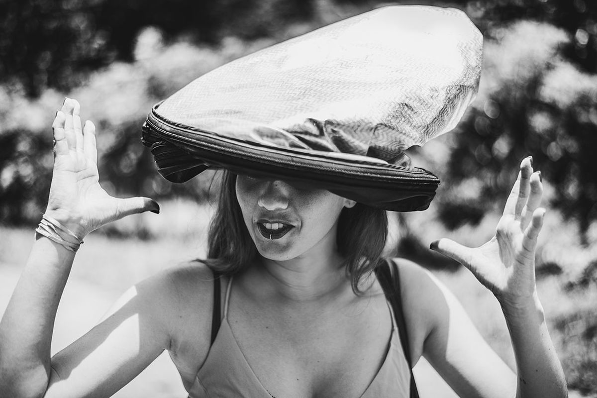 real people, hat, lifestyles, headshot, clothing, leisure activity, portrait, front view, one person, focus on foreground, women, day, young adult, emotion, young women, females, happiness, casual clothing, outdoors, human arm, human face