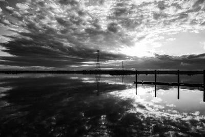 Pier over lake against sky