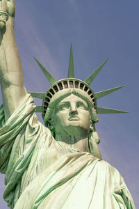 Low angle view of statue against sky