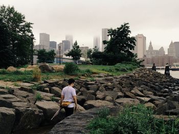 Rear view of woman standing in park
