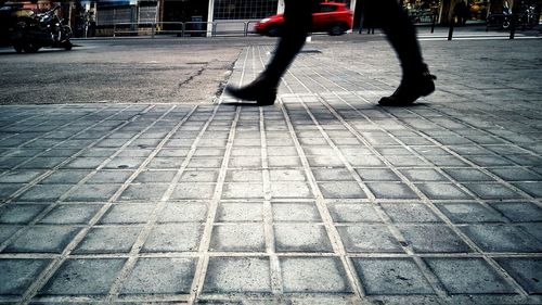 Low section of men on sidewalk