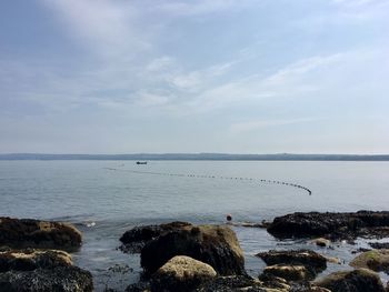 Fishing boat out at sea in filey, east yorkshire, united kingdom