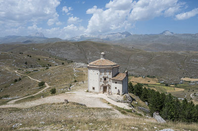 The church of santa maria della pietà in rocca calascio with the beautiful abruzzo mountains