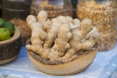 Close-up of ginger in container at market stall