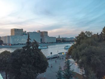 High angle view of buildings and trees against sky