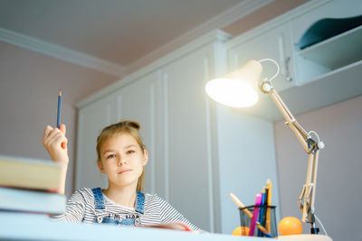 Portrait of girl studying at home