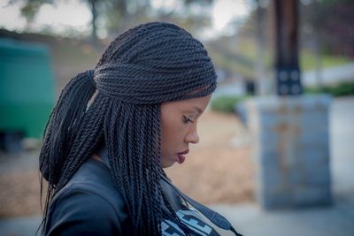 Close-up of young woman with braided hair