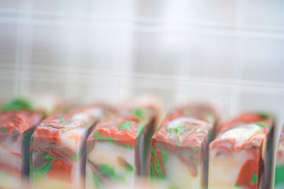 Close-up of multi colored candies in row