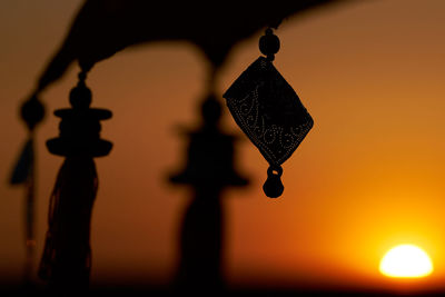 Low angle view of illuminated electric lamp
