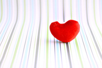Red heart artificial for decoration on multicolor background. encouragement concept.