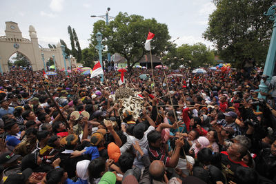 Crowd on street during ritual celebrations