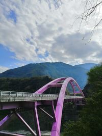 View of bridge over mountains against sky