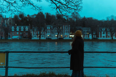Rear view of woman looking at lake