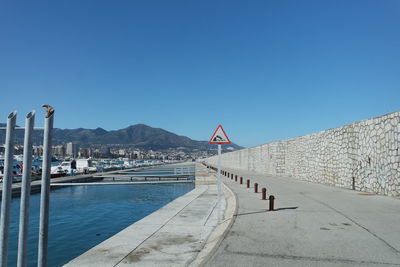 Scenic view of mountain against clear blue sky