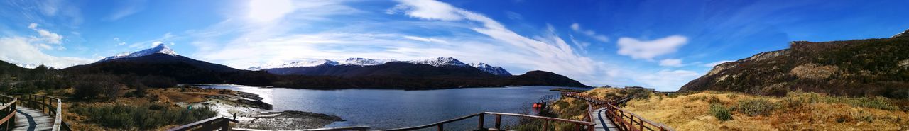 Scenic view of lake against cloudy sky