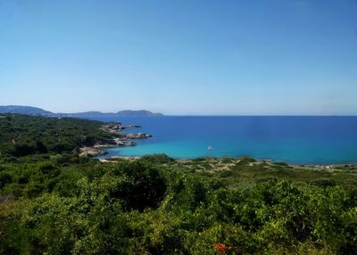 Scenic view of sea against clear blue sky